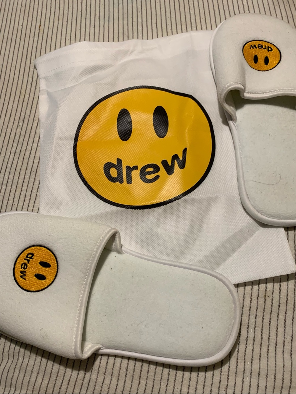 drew house White Slides with Yellow Smiley Logo